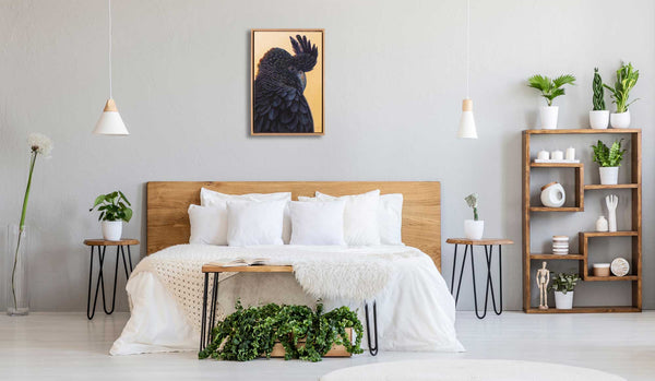 Original painting of red tail black cockatoo called 'Hidden Red Tail' by Swapnil Nevgi shown in home setting