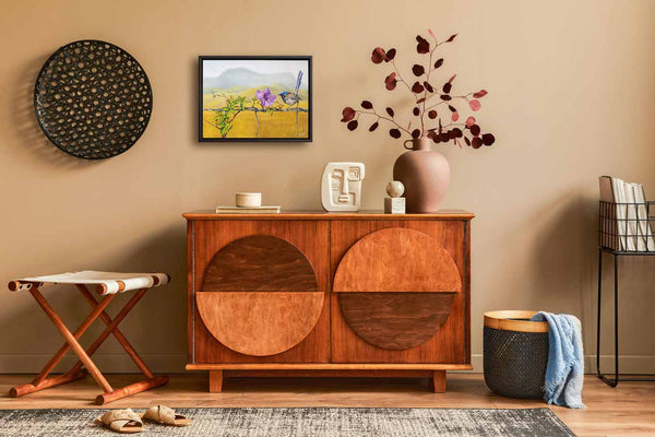 Another image of original painting Floral Affair is shown in its frame in a home like display for better understanding of what it will look like in your space.