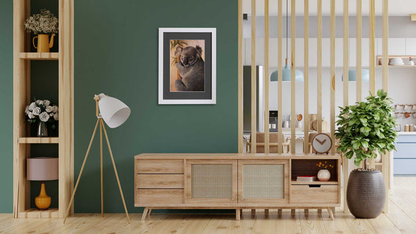 koala wall art paper print shown in home setting is created from 'Drop Bear' painting by Swapnil Nevgi