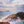 Ocean landscape wall art showing waves washing over basalt rocks under a soft pastel sky, captured in long exposure for home and interior décor.